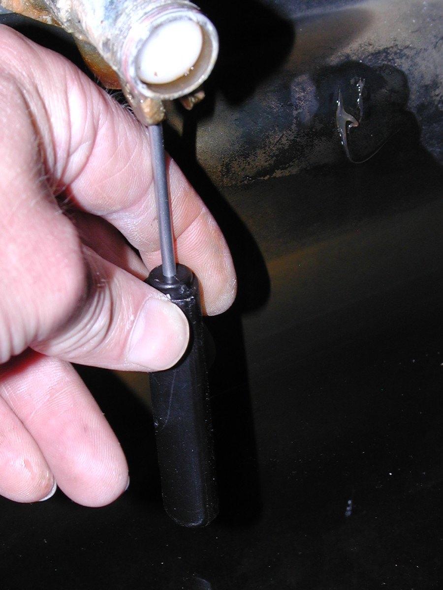 Push the valve out with a screwdriver