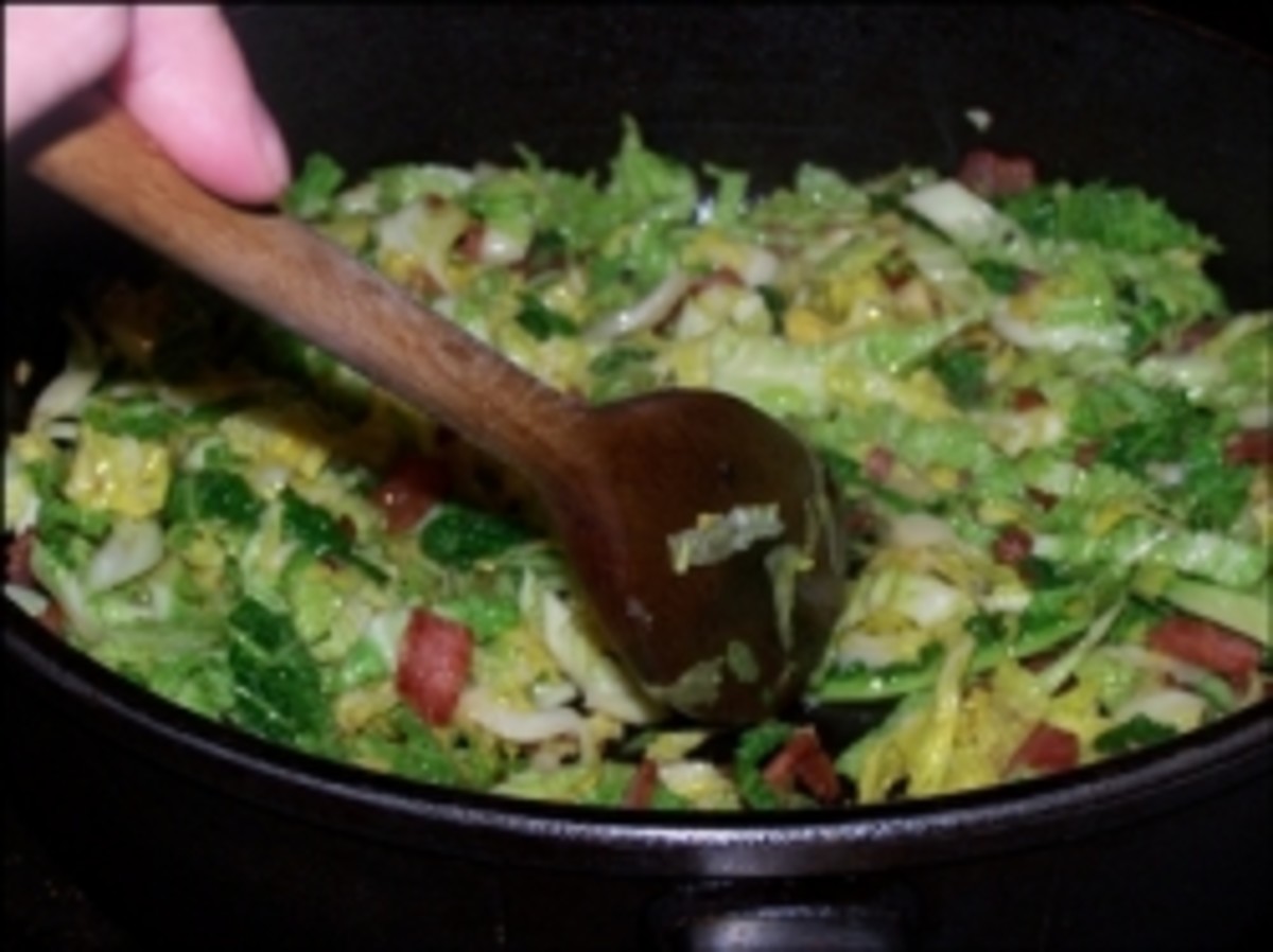 Sauteing cabbage and bacon in the SKK pan.