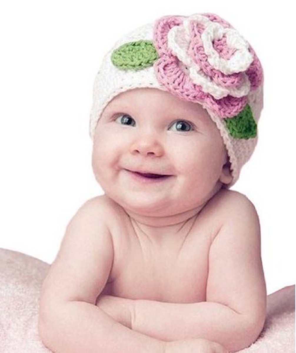 White baby hat with flower
