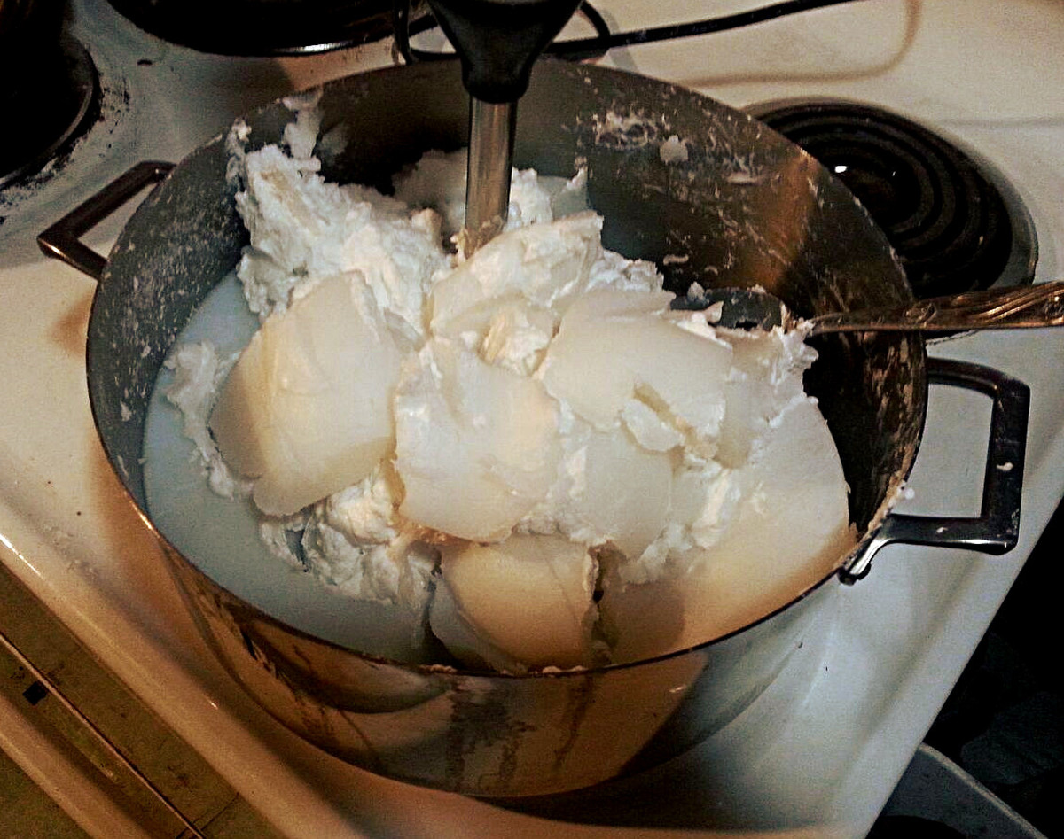 Breaking up the hardened soap with a spoon before stick blending will make the job faster and easier.