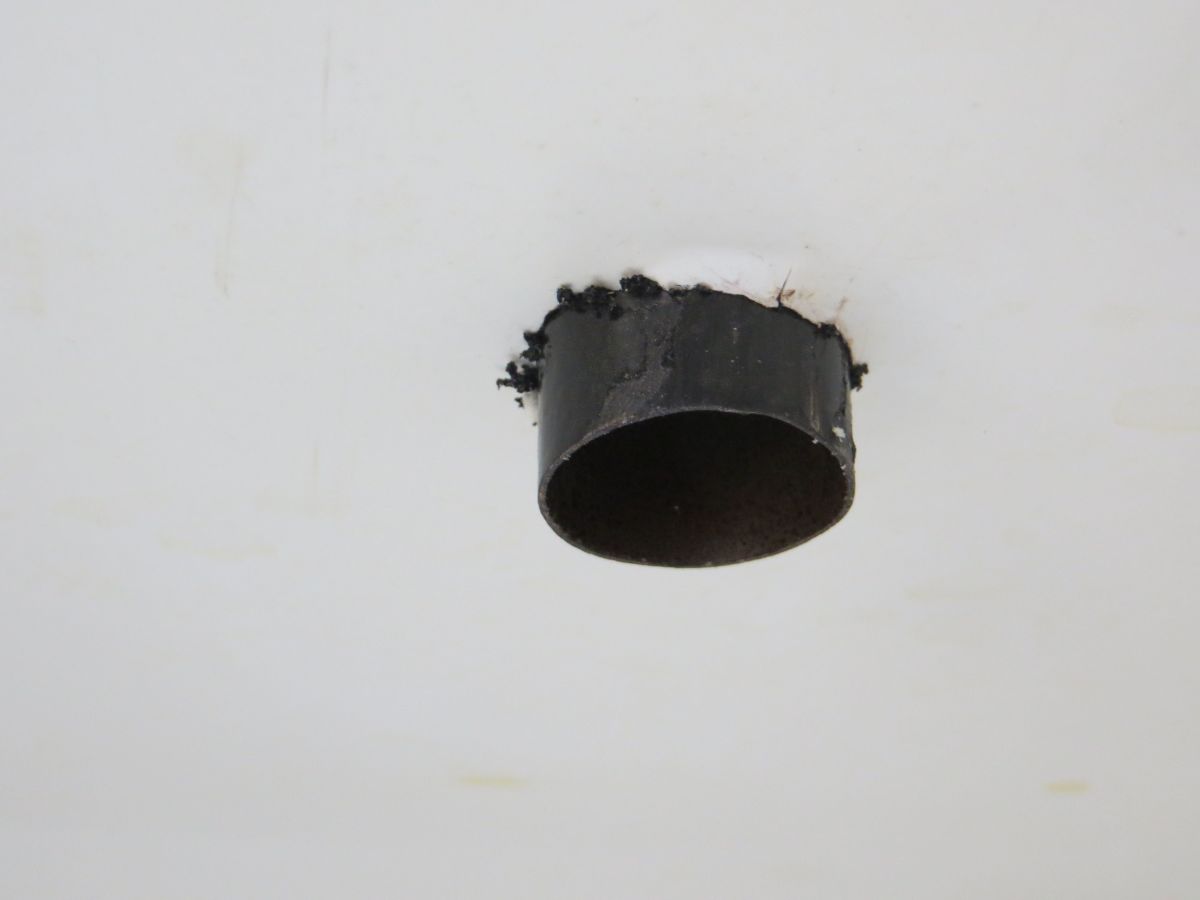 A close-up of the fitted chimney in its aligning hole.