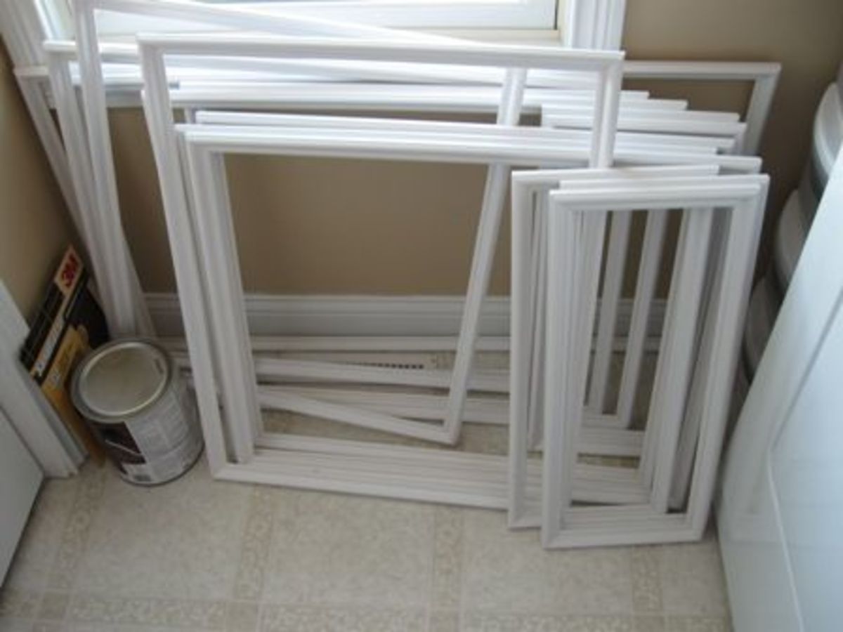 A pile of "picture frames" created from molding that became part of the DIY wainscoting.