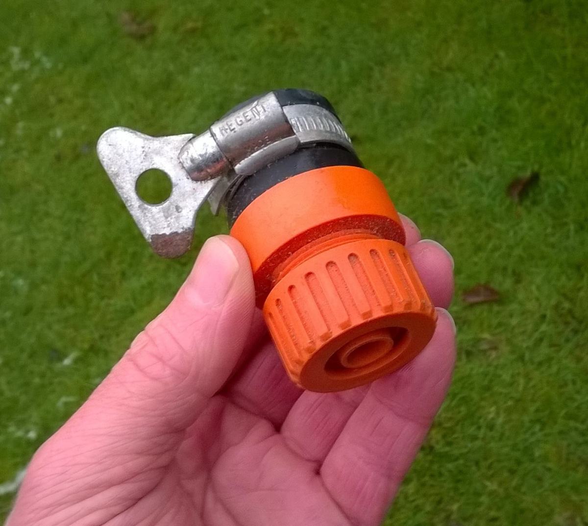 This fitting has to be loosened and removed from the tap if someone needs to use it. The fitting is held in place on the hose by the knurled ring.