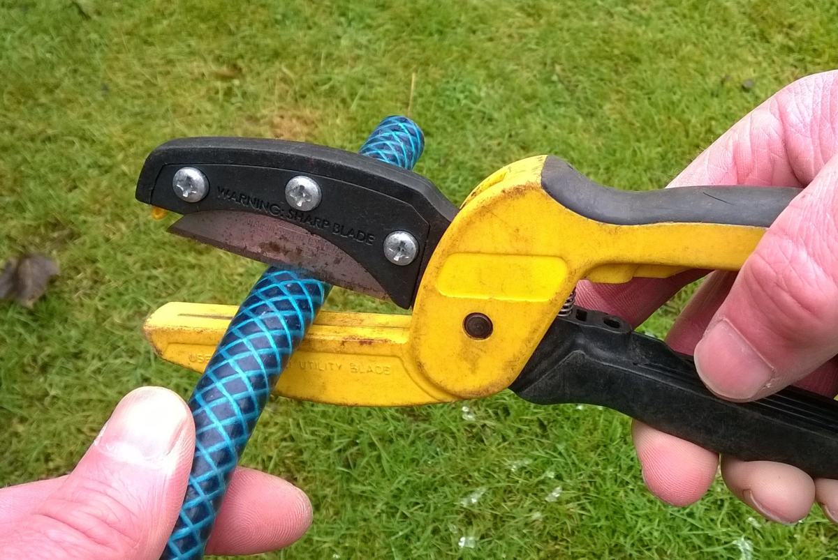 This tubing cutter which uses "Stanley" knife blades is useful for cutting hose square