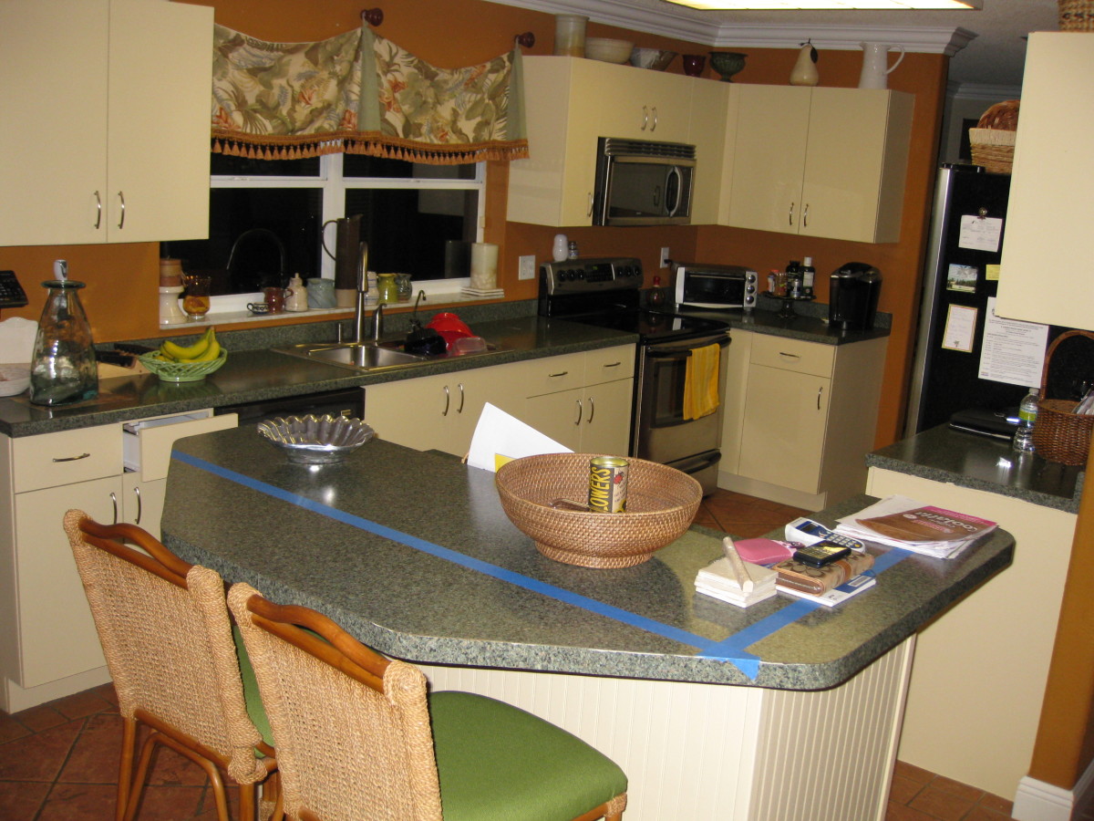 After: Just painting the cabinets makes a dramatic difference in the appearance of this kitchen.