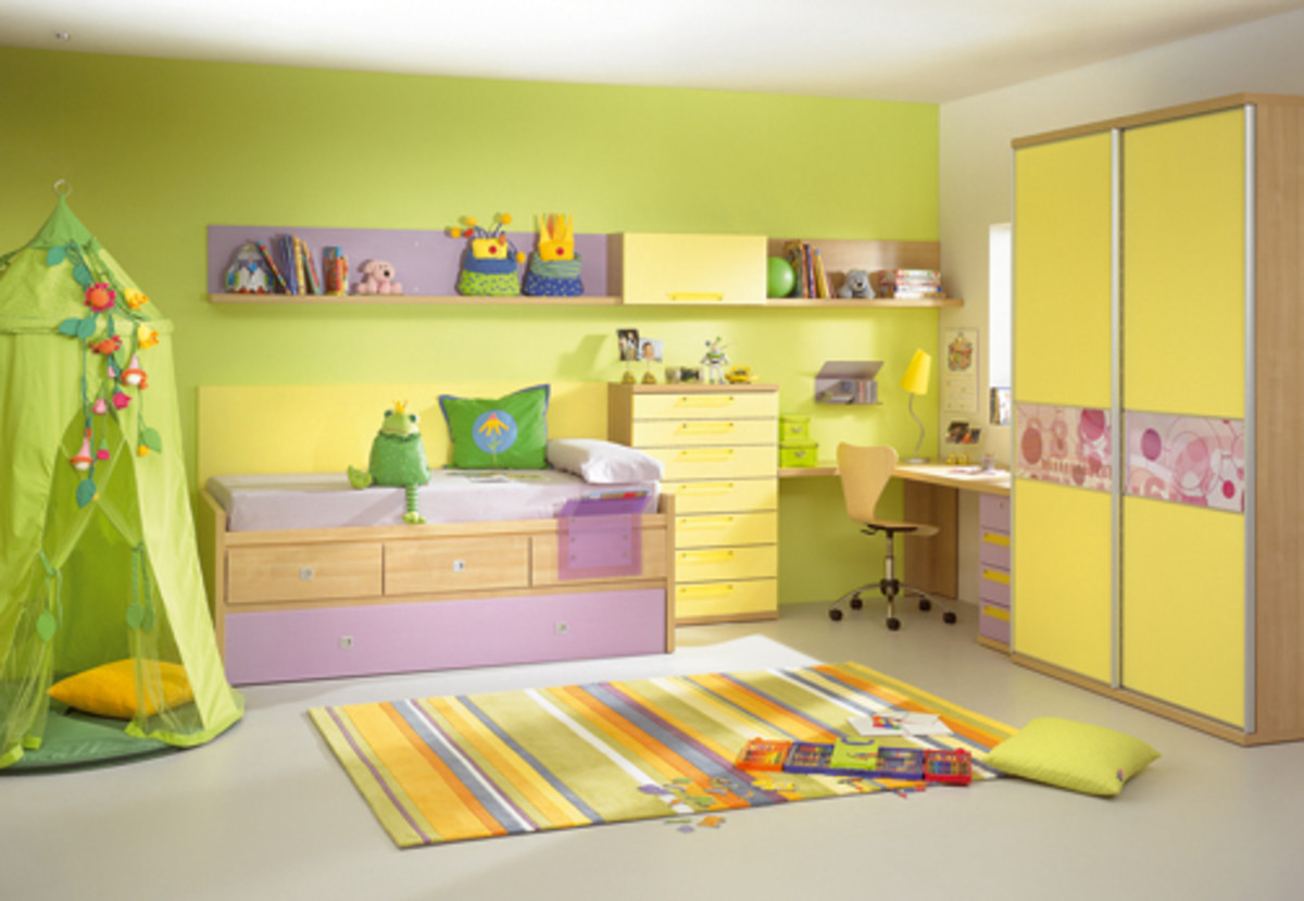 Here's a great example of the use of a bright color on one wall to add some fun to a child's room.