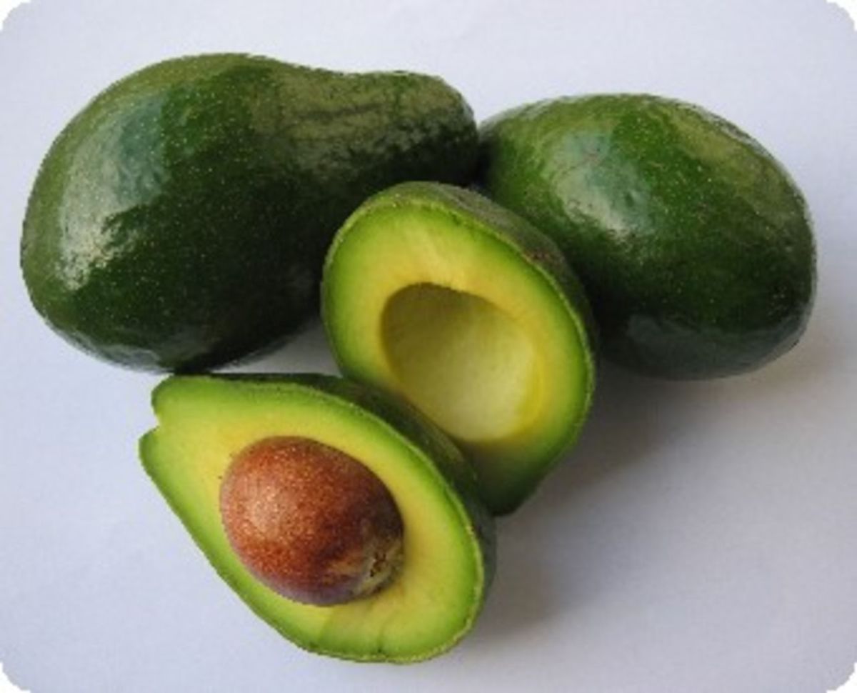 Fresh avocados and their seed.