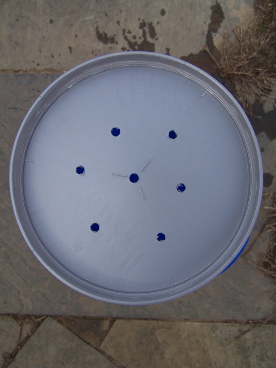 I drilled a hole in the center of the lid and then six more around it in a hexagon pattern.