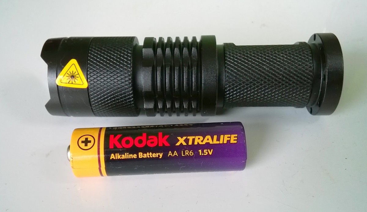 LED torch with zoomable beam. Runs on a single AA cell. Much brighter than a double AA Maglite.