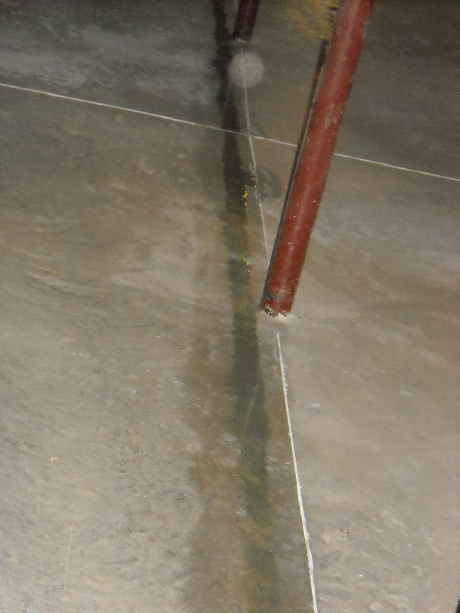 Trail of water from sweating plumbing pipes.