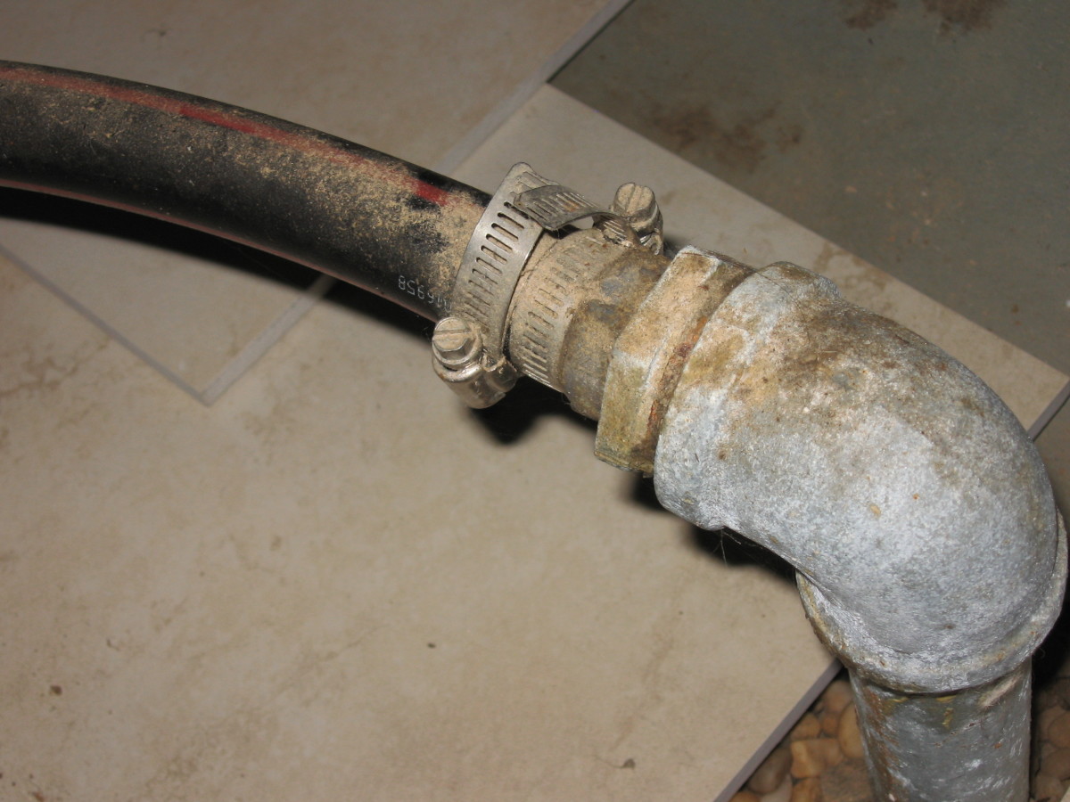 In this author's illlustration, you can see the galvanized elbow which is attached to the top of the last driven section of well point pipe. The black flexible hose attached to this side of the point leaves and enters at the check valve side of pump.