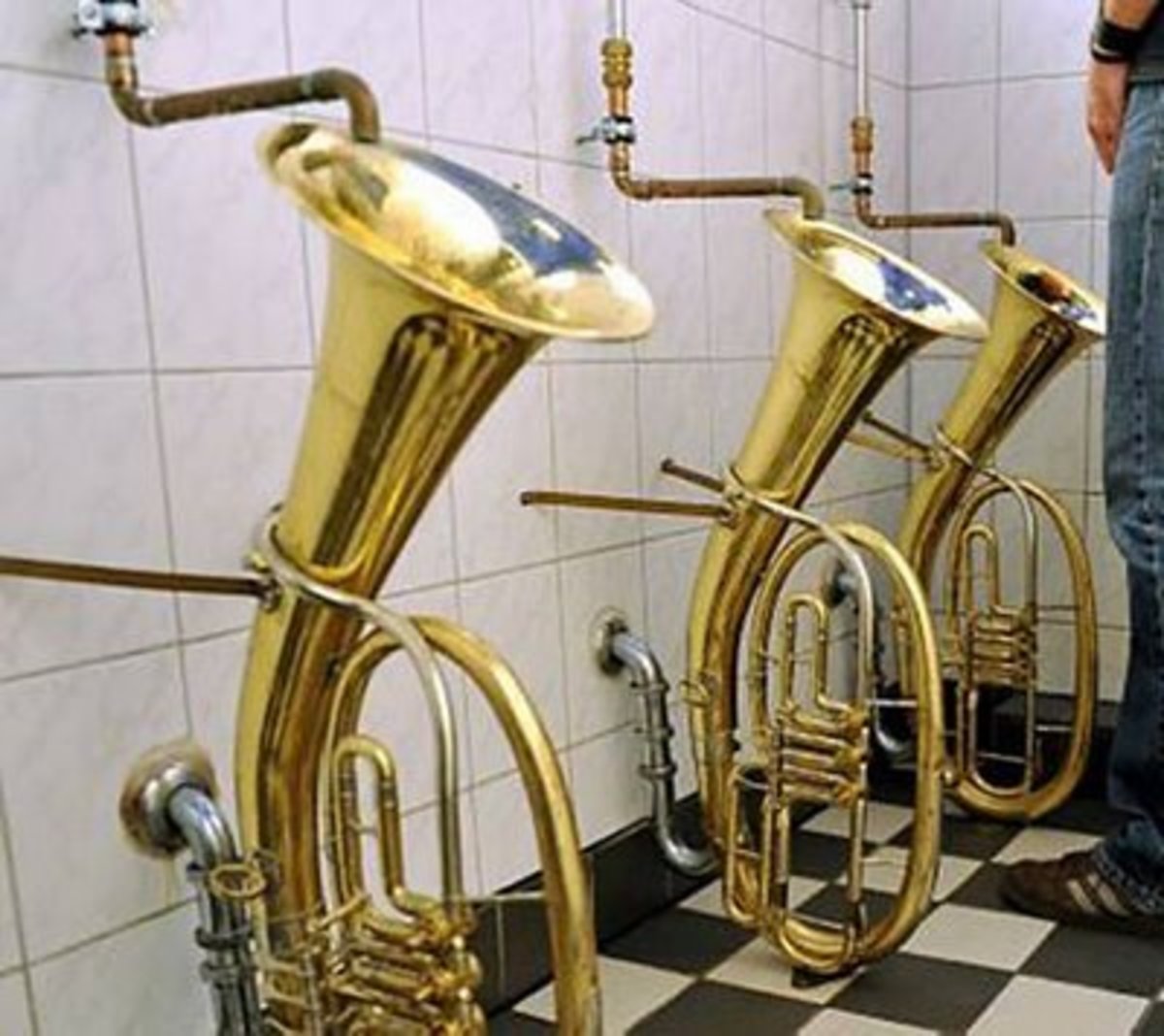 Tuba shaped urinals provide musical inspiration as you visit the restroom. No, they don't play music as you go!