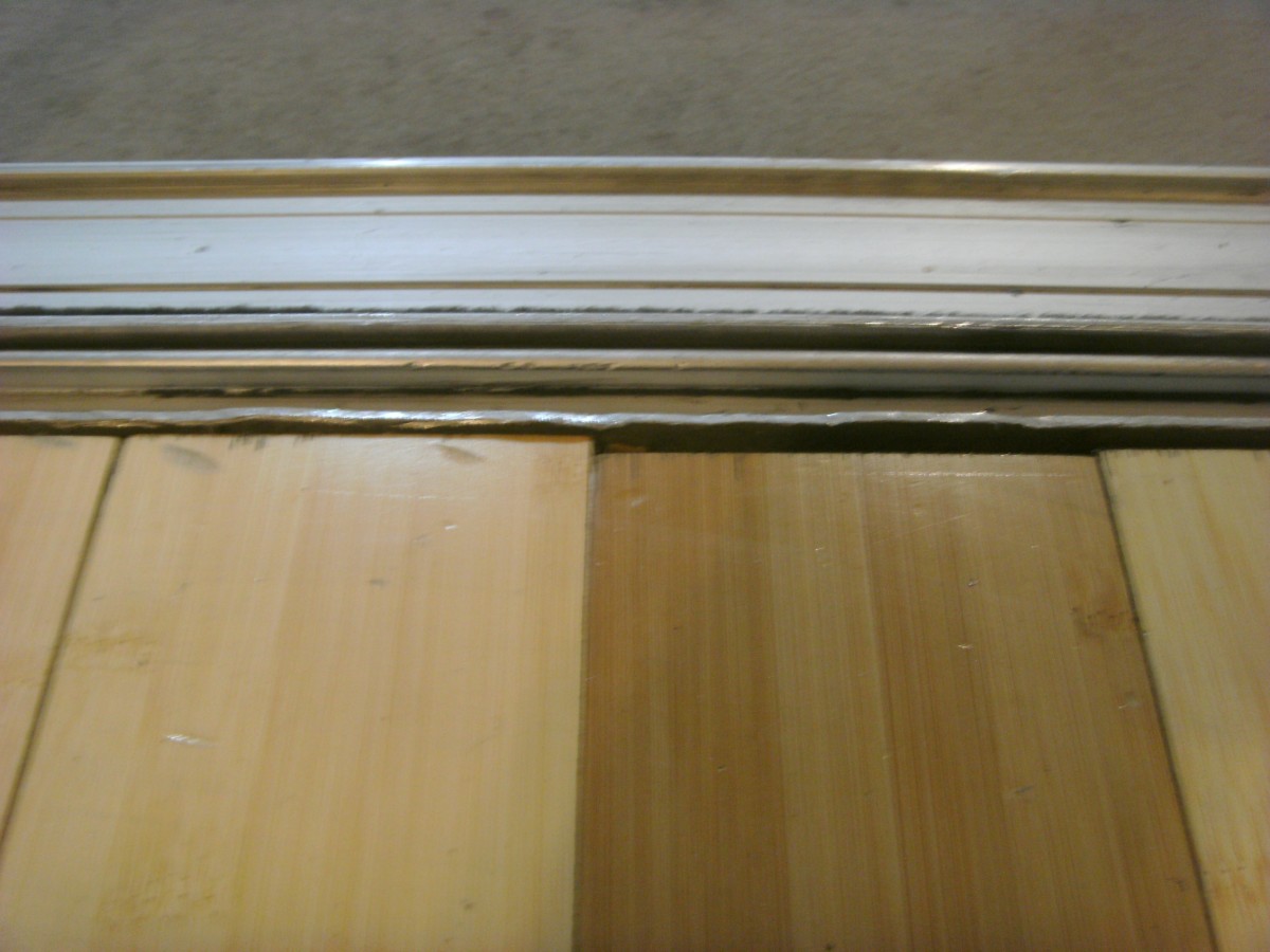 The edge of the inner track has been ground down to allow removal of the door.