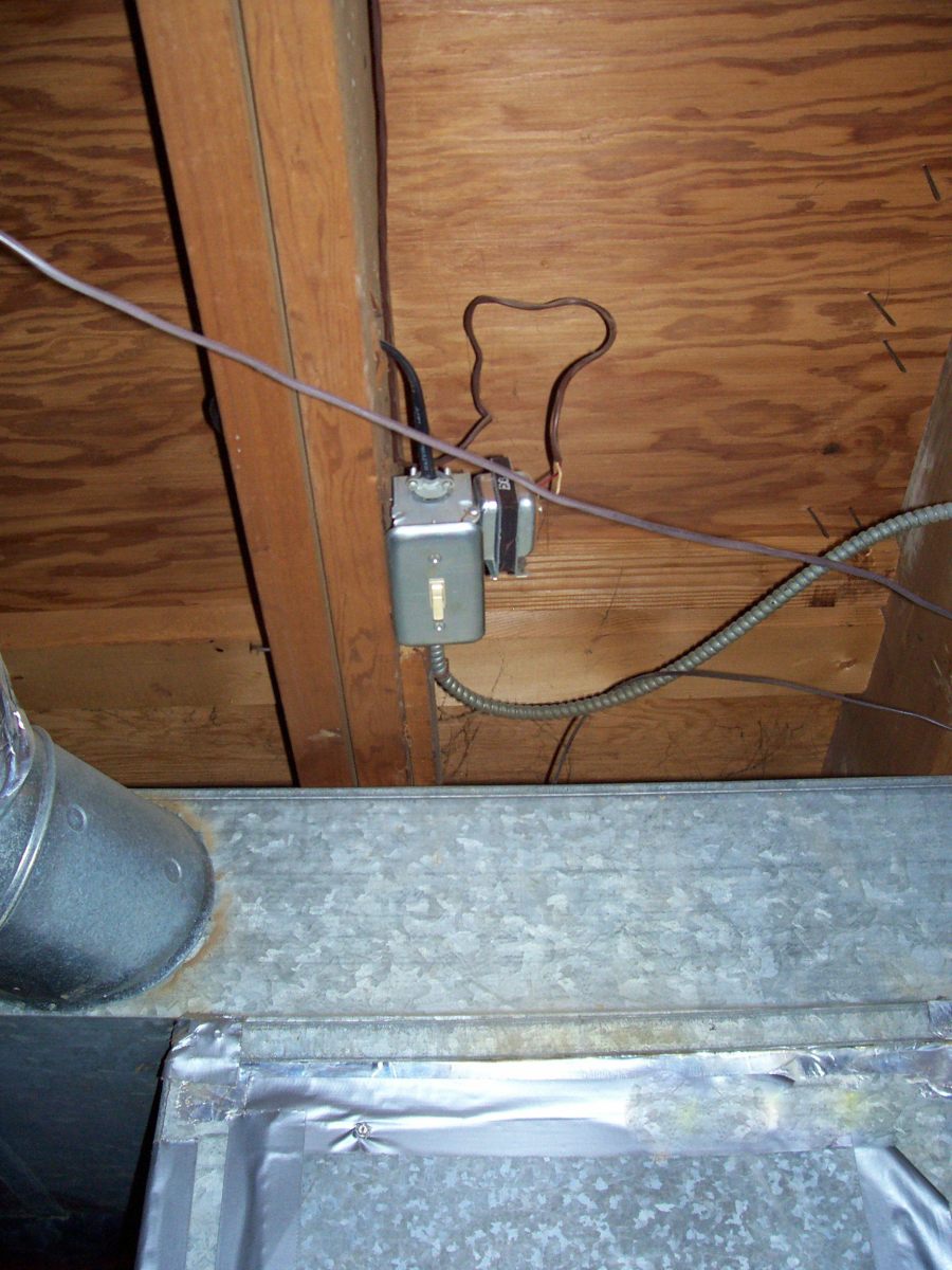 A toggle switch that has been mounted in the ceiling near the furnace.  Your toggle switch may be on the furnace, or you may have to shut off the unit at the circuit-breaker panel.