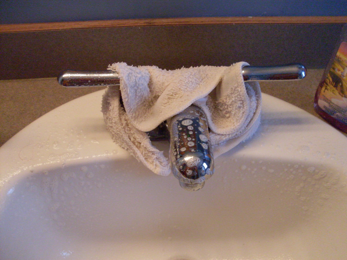 I usually spray the faucet with a vinegar mixture (either the one for windows or tubs works well) then I wrap a vinegar soaked towel around the faucet where the build-up is the worst.