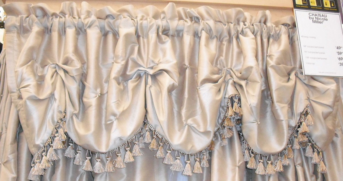 A silky scalloped valance with fringe looks great in a formal room.