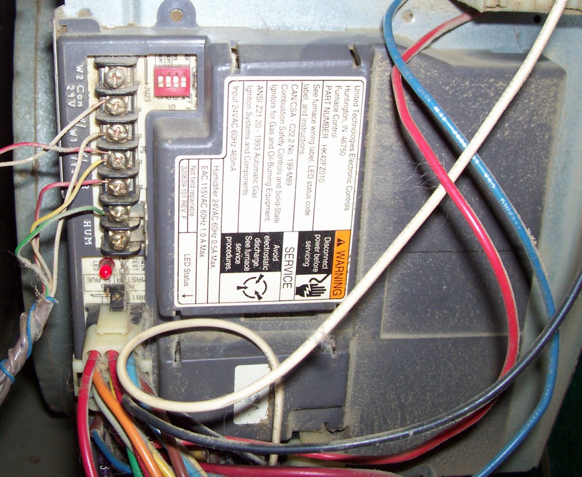 On this furnace circuit board, you can see the red LED at the bottom left that will blink me a code to point me in the right direction.