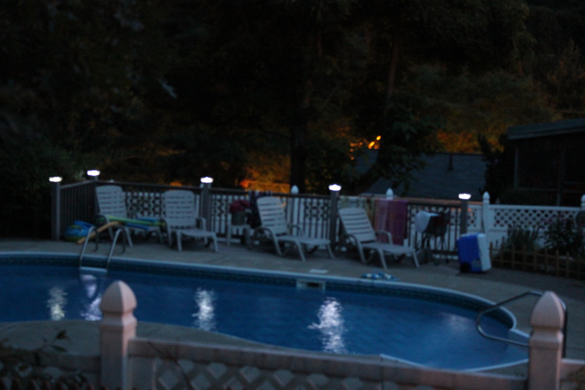 LED solar lights along the side of a pool, they don't really light a path, but put a twinkle on the water.