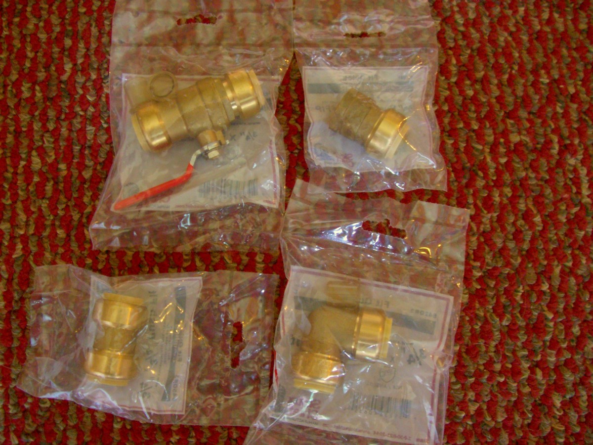 Here you have a push fit valve (top left), coupling (bottom left), elbow (bottom right) and adapter (top right).