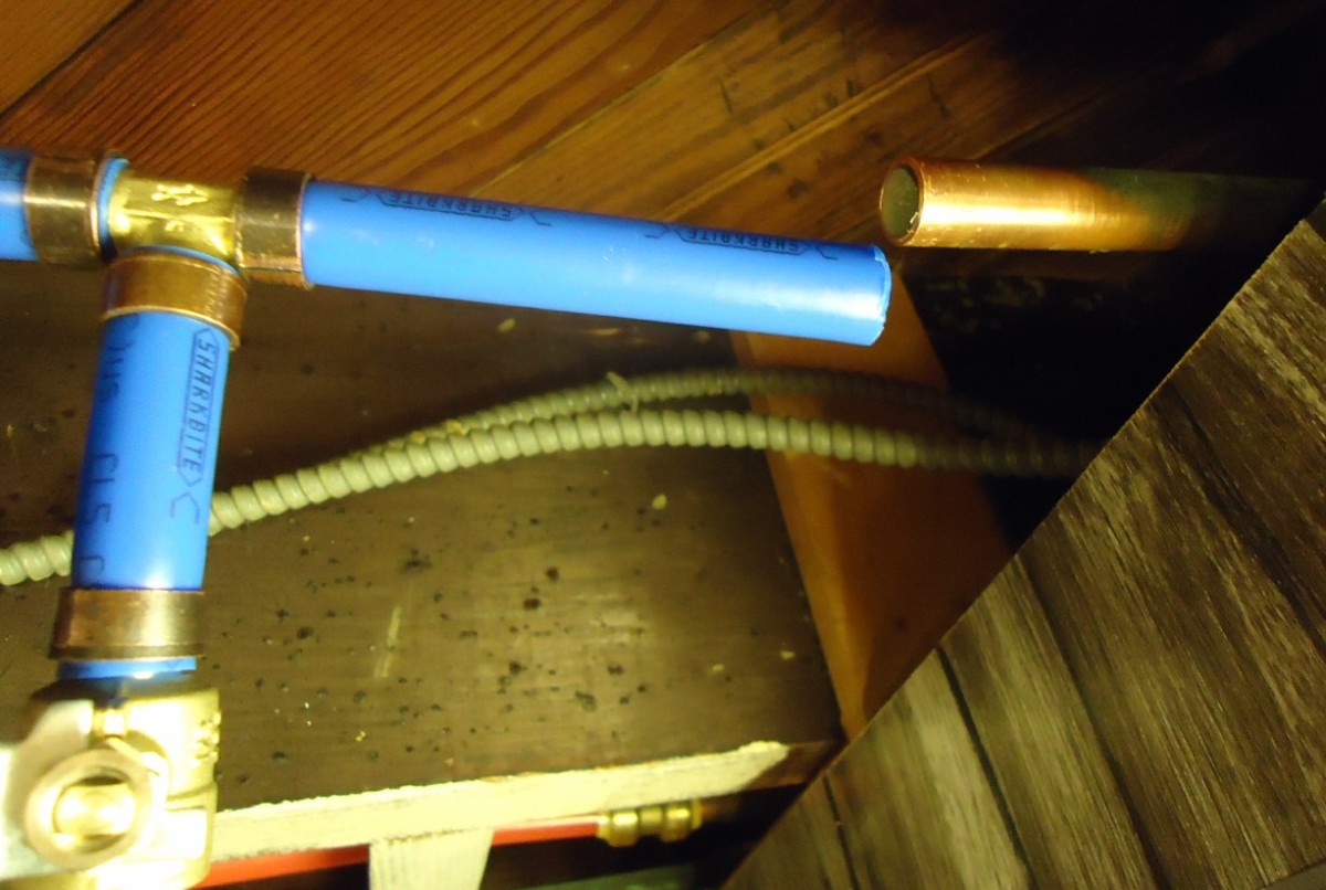 A crimp ring squeezes the PEX pipe against its plumbing fitting.