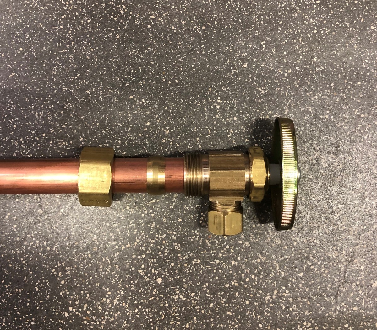 A compression-style angle stop valve