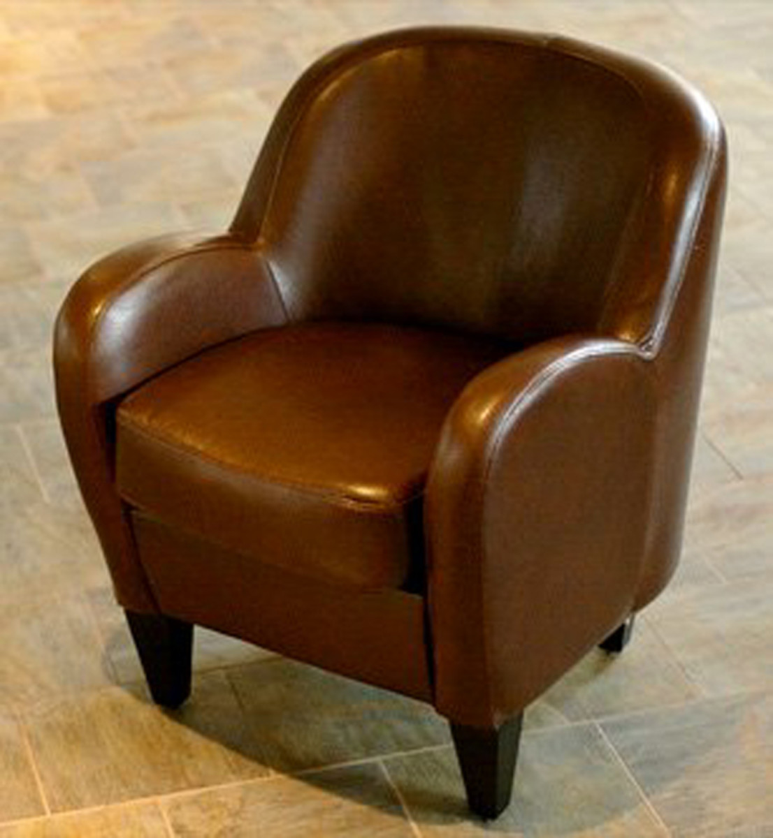Curved and plump, this chair exemplifies furniture from the art deco era.