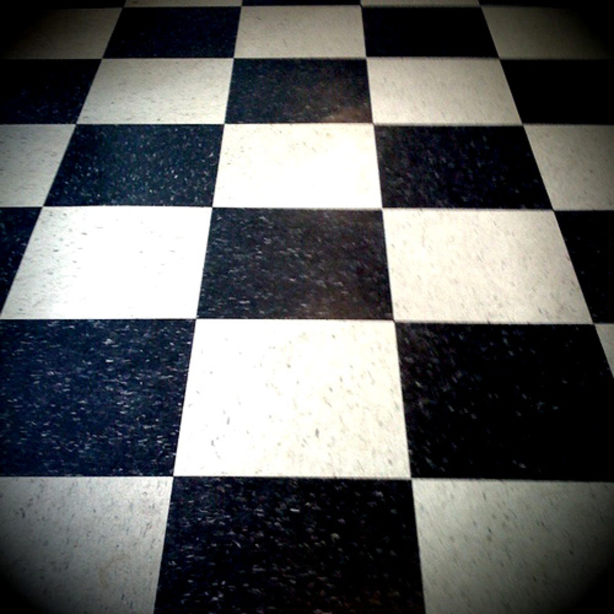 Deco-style linoleum checkerboard floor.