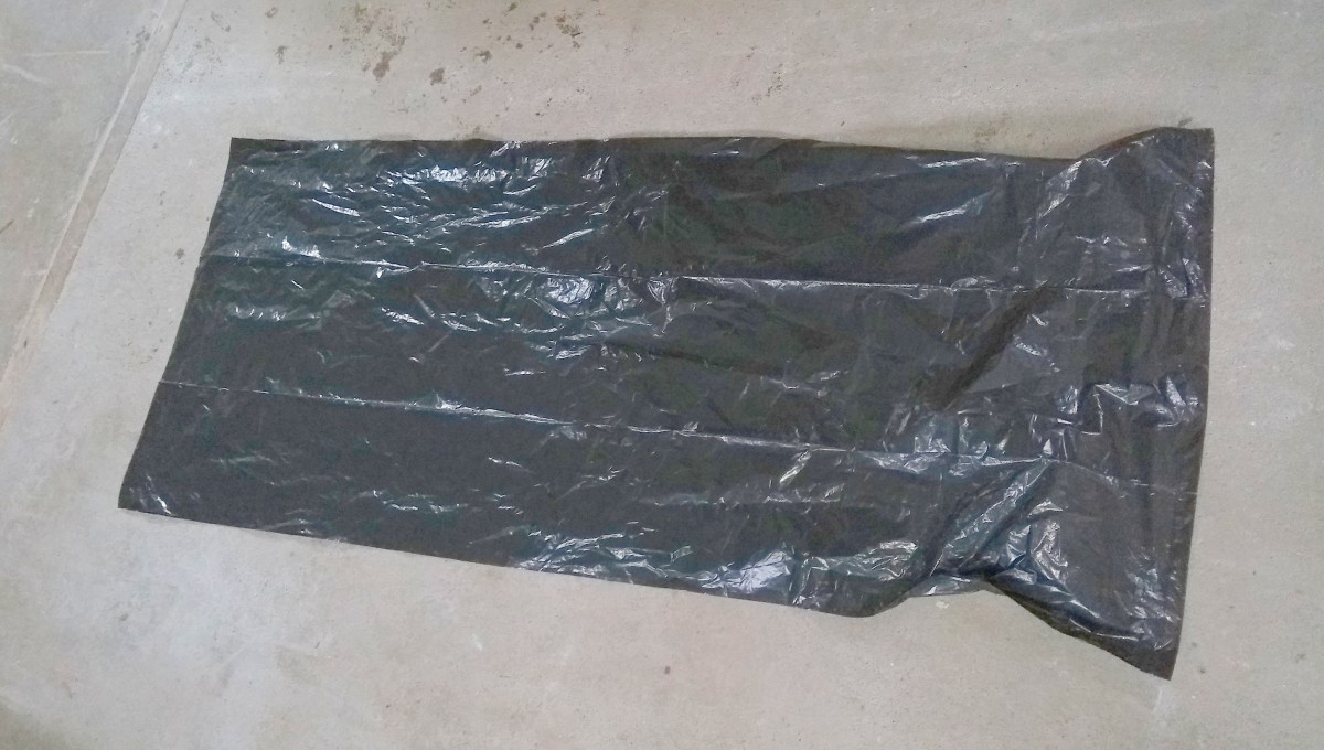 Cover the floor with a refuse sack (trash bag), newspapers, plastic sheet etc.