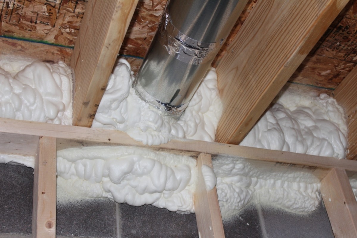 At the band joist, foam insulation is preferred over fiberglass, but either will do.