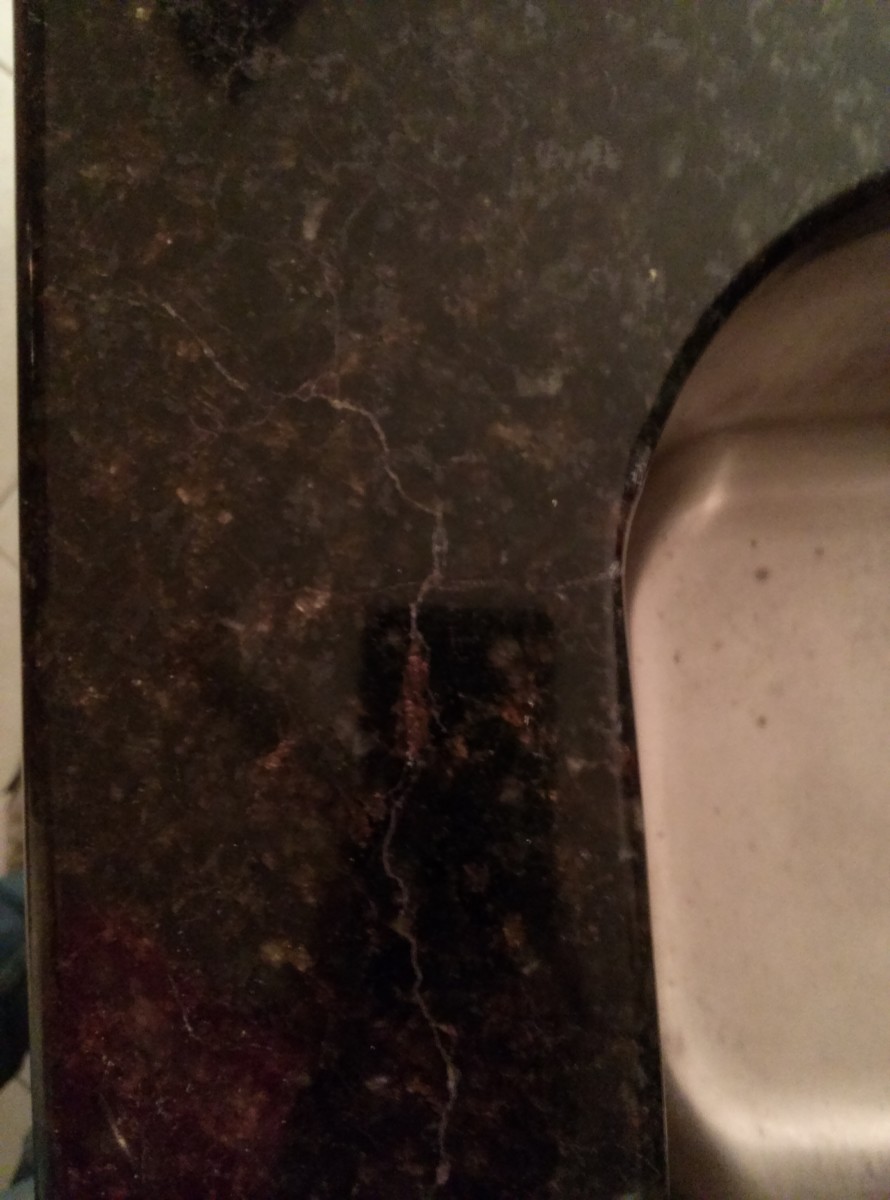 rusting-reinforcement-rod-repair-in-granite-countertop