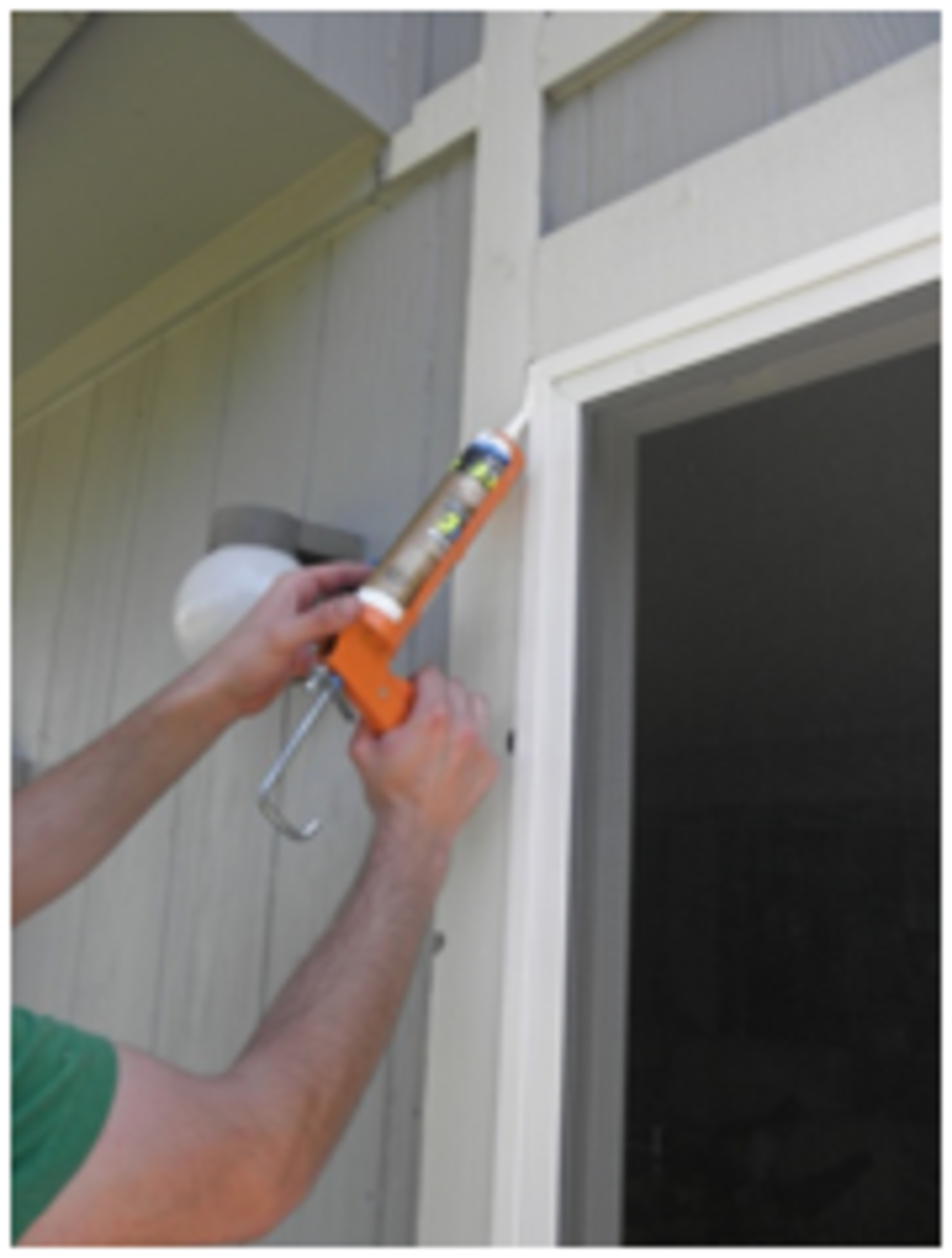 Apply silicone caulking to seal the edges of the doorframe.