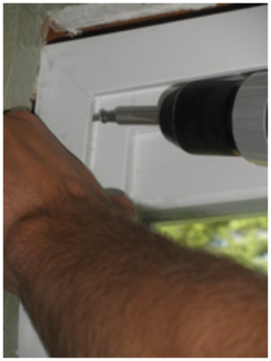 Screw each corner and center of the doorframe to secure.