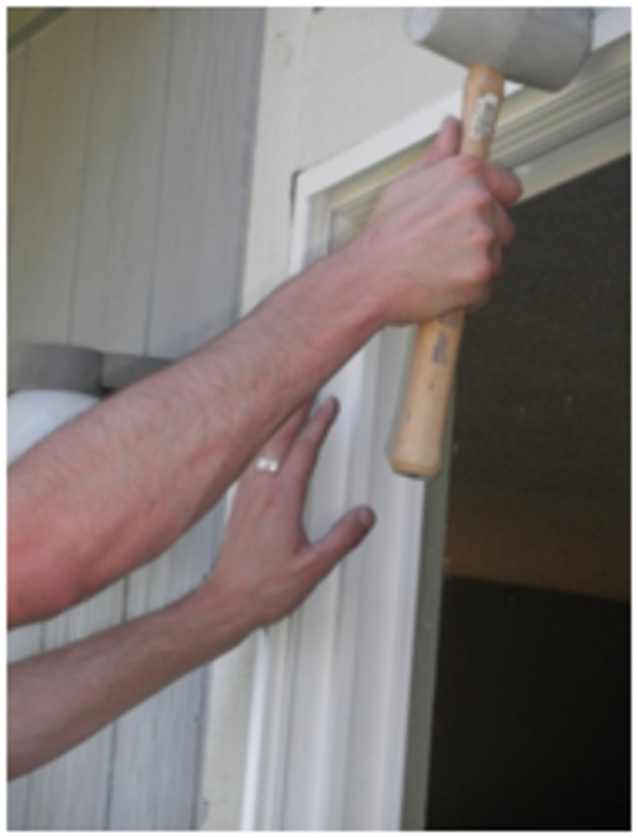 Use a rubber mallet to tap doorframe into place.