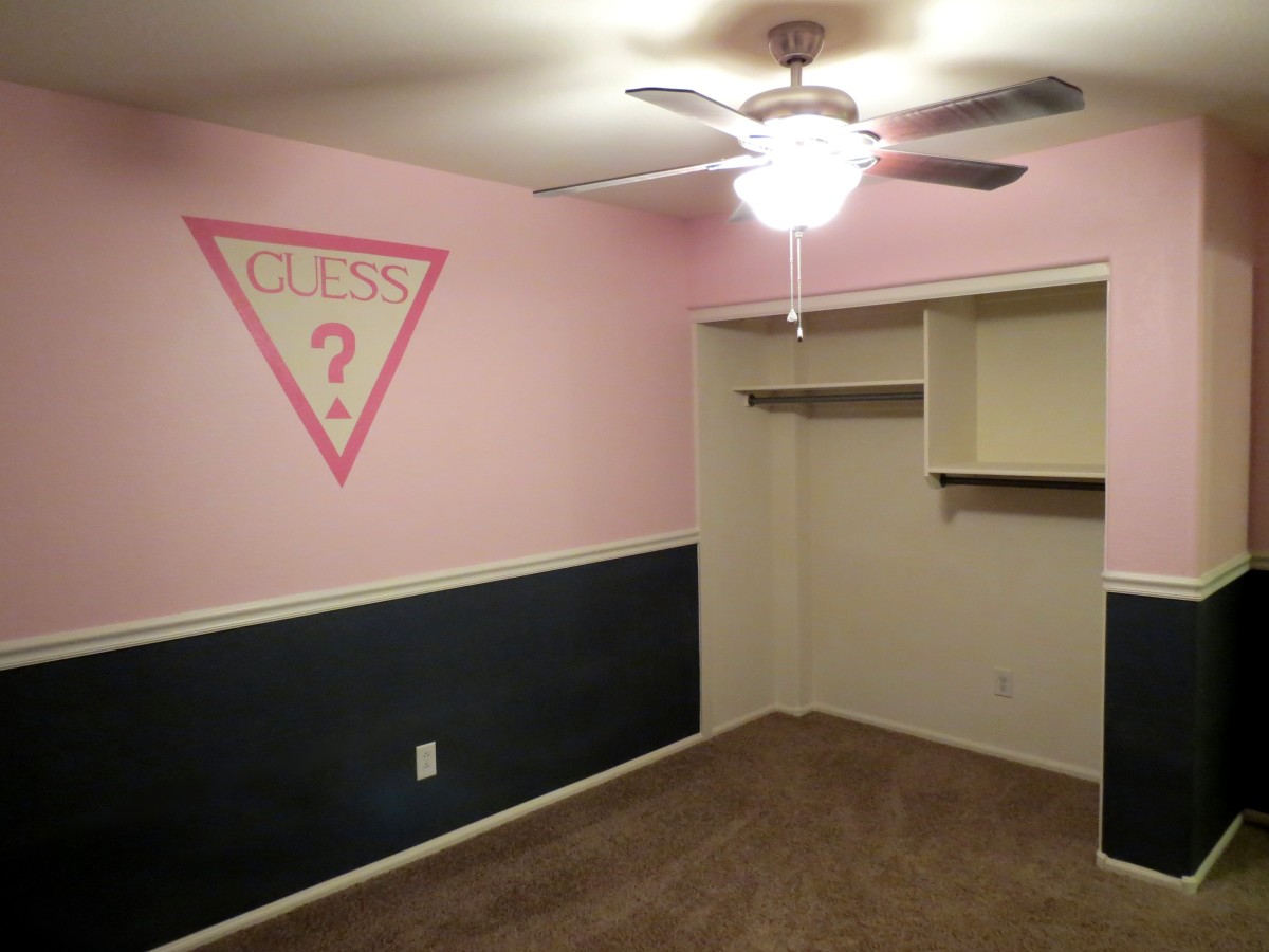My daughter's painted bedroom with hand painted Guess logo. I still need to put up the closet doors.