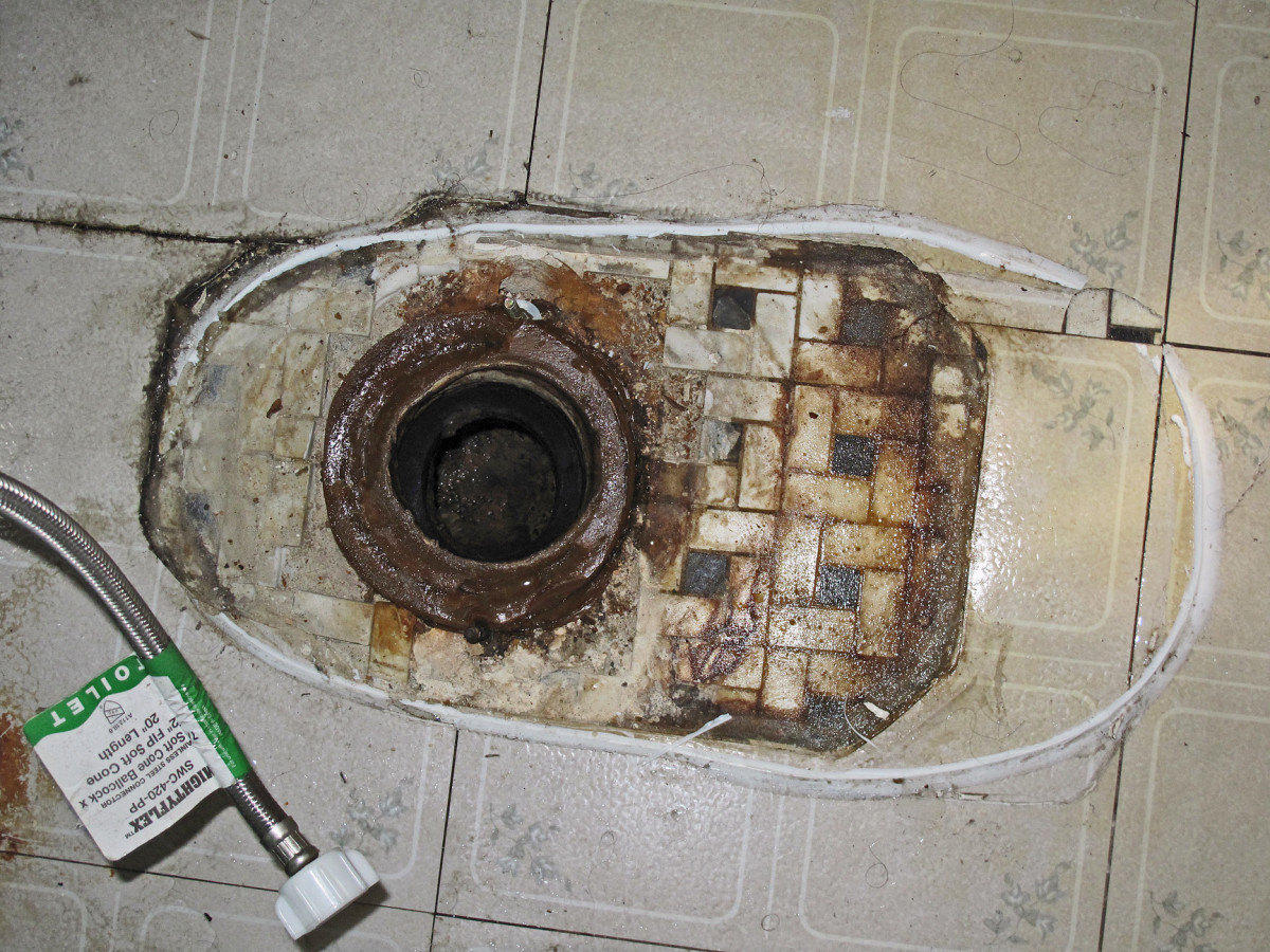 A damaged wax ring shows up as seepage around the toilet's base.