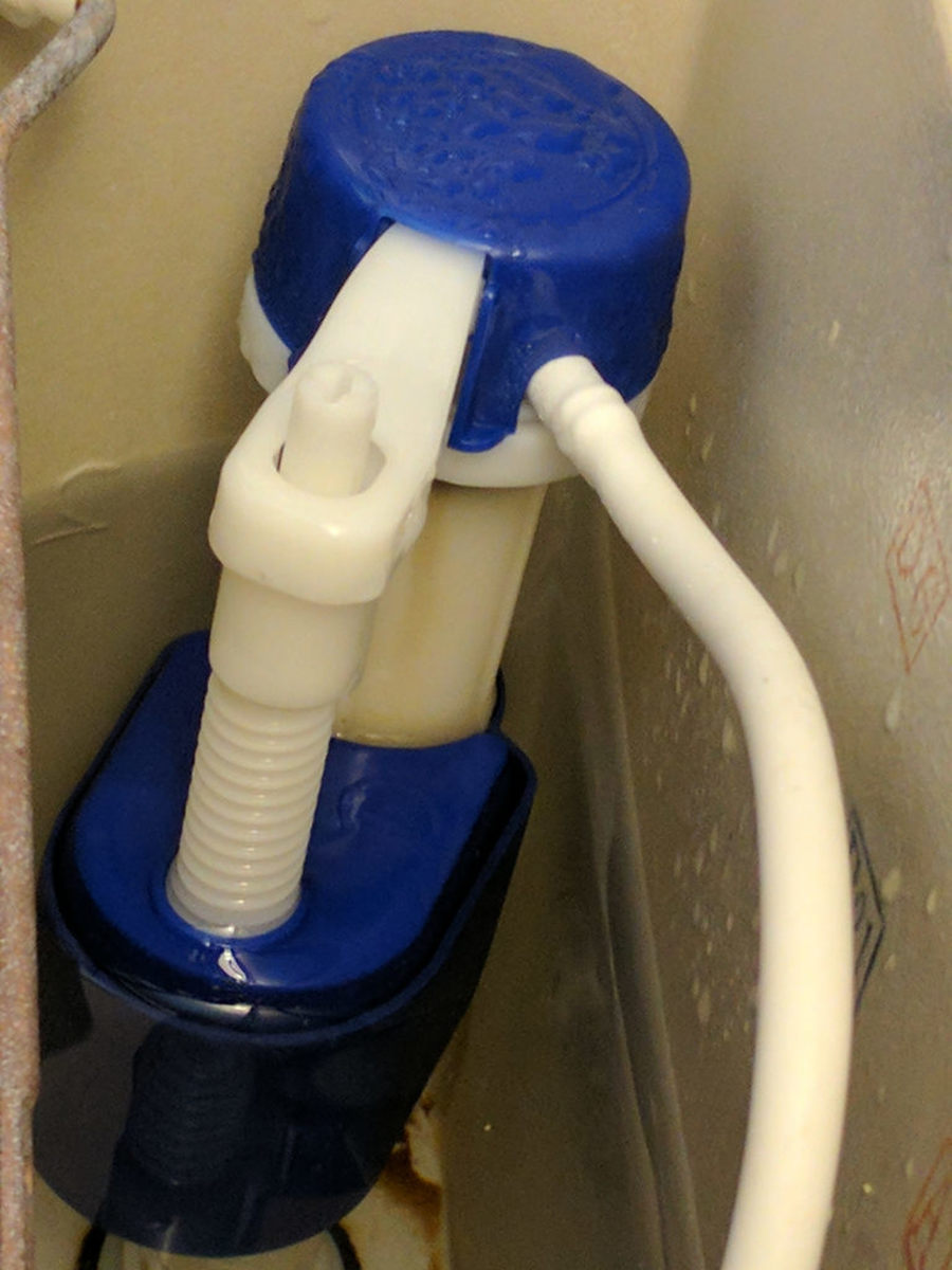 Use the threaded rod between the actuator arm and the float to adjust the tank's water level.