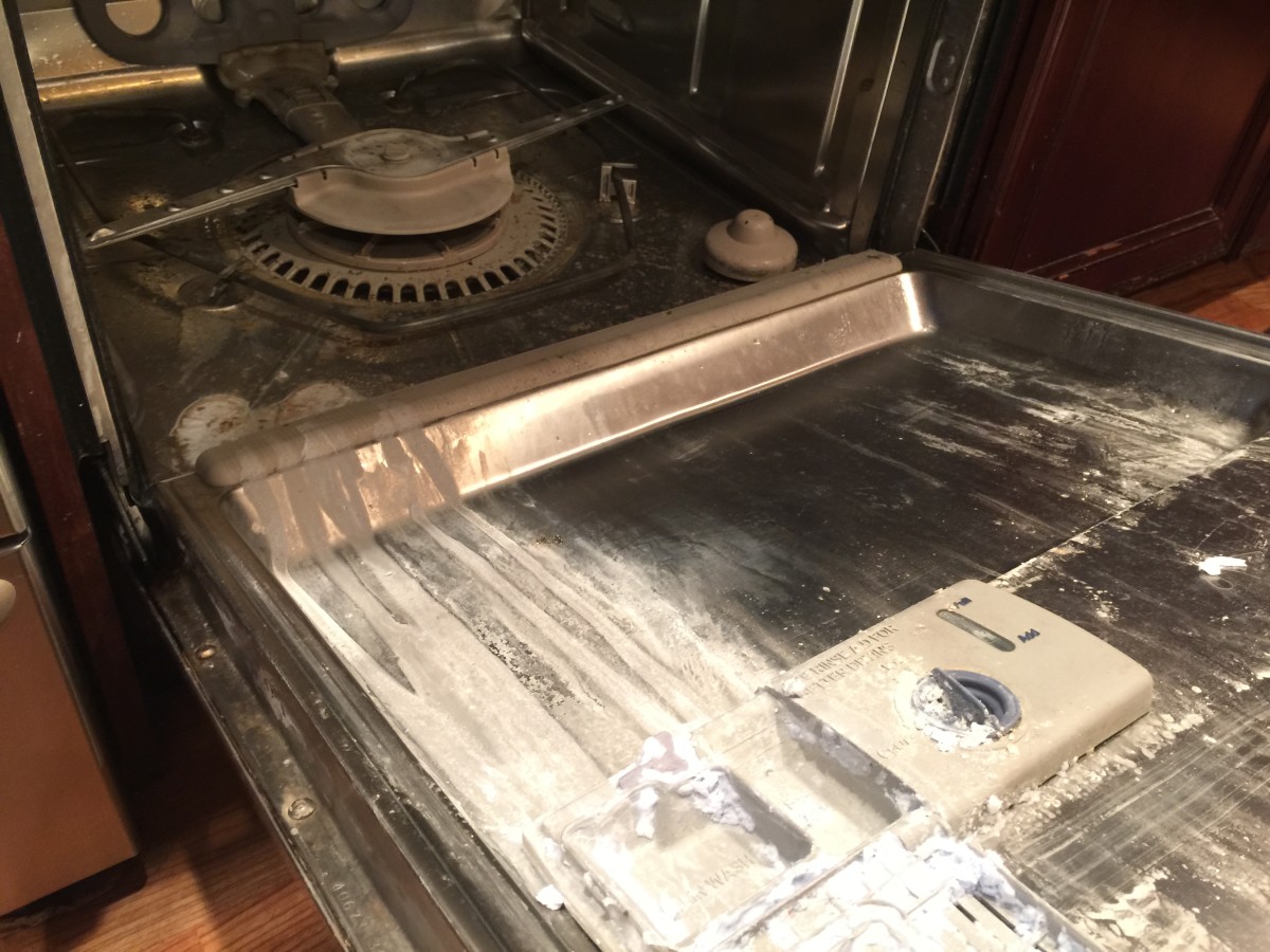 Dishwasher with caked-on lime deposits.  Time for CLR and white vinegar.