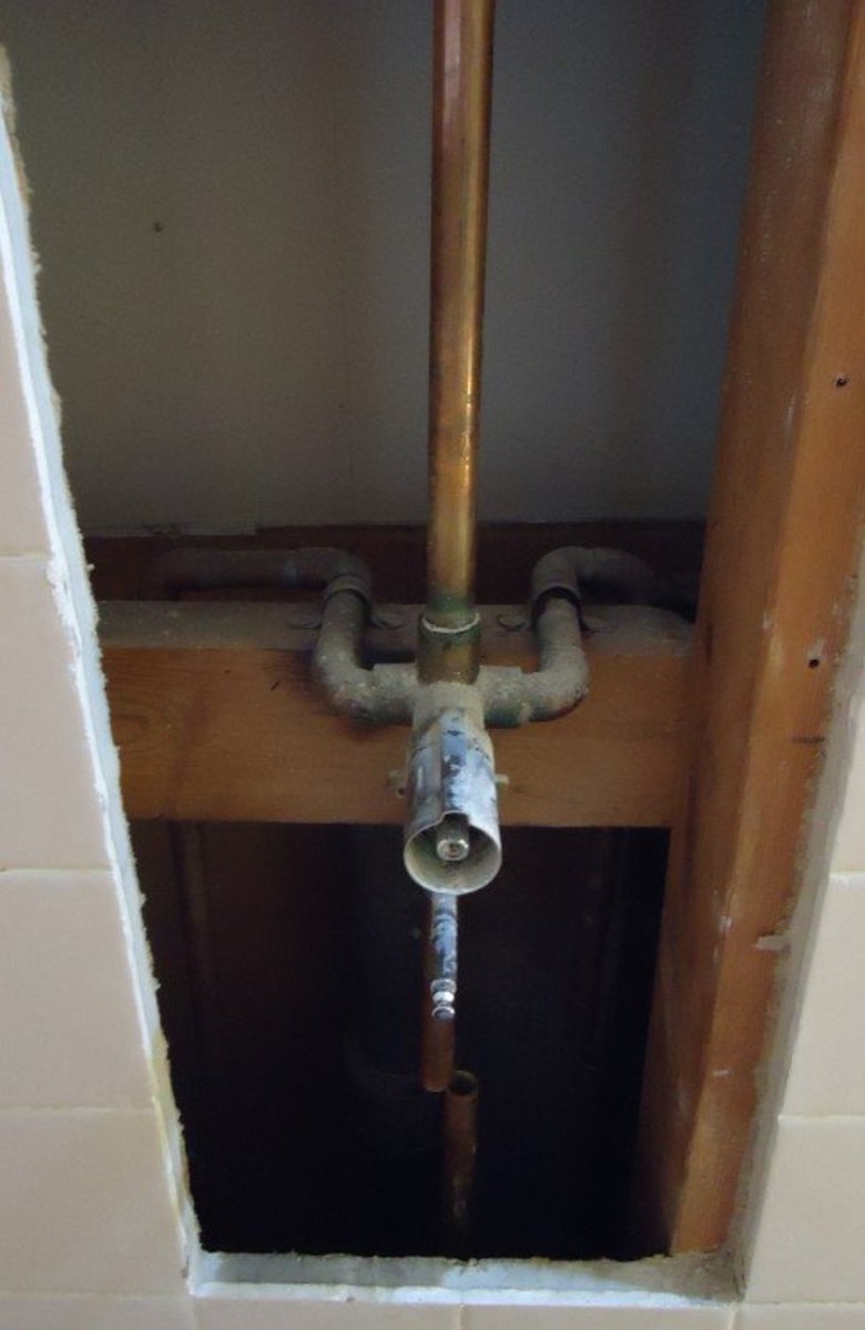 A typical older shower valve installation.