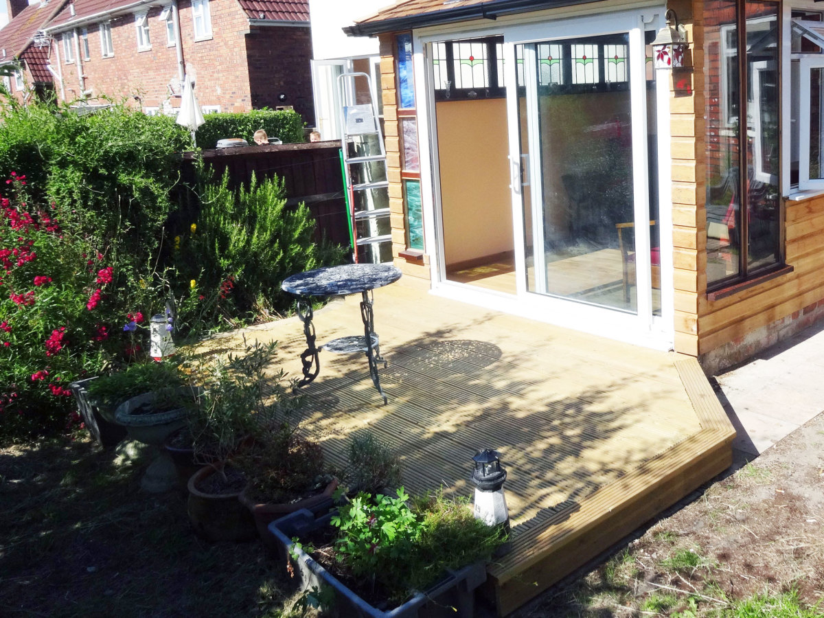 Decking edged with plants.