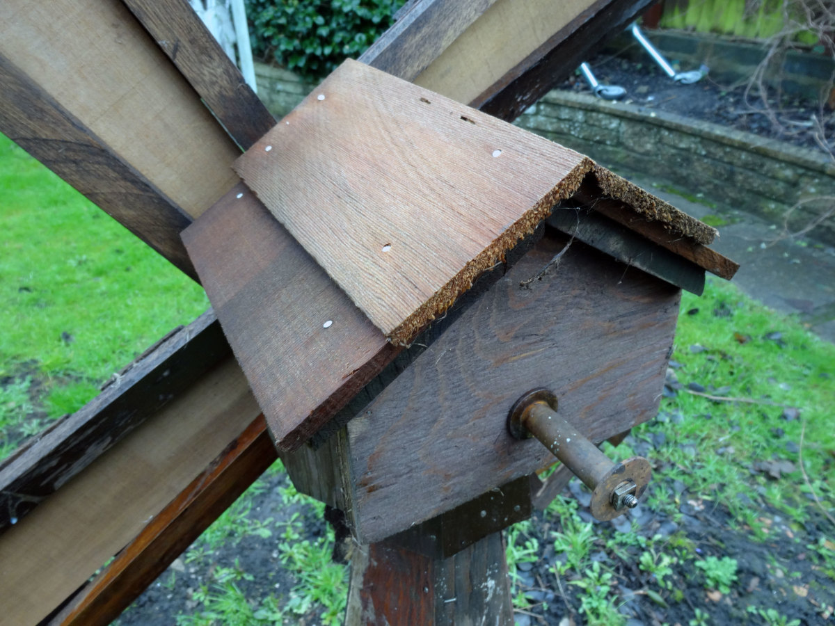 Windmill's roof made with red cedar tiles.