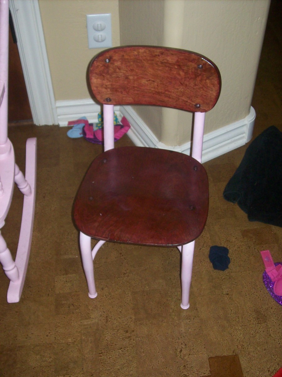A kindergarten chair stained, varnished, and painted - pink, of course