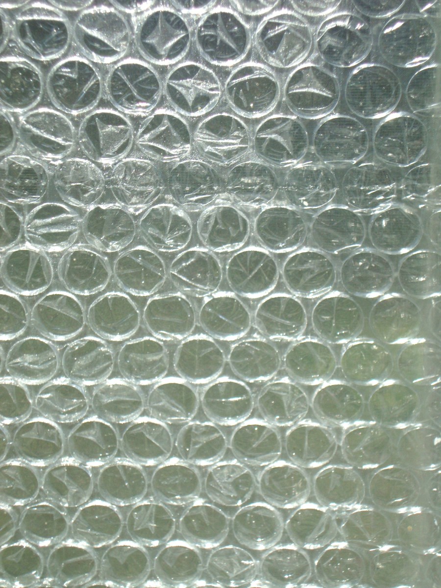 How to use plastic bubble wrap on windows to keep your house warmer in winter.