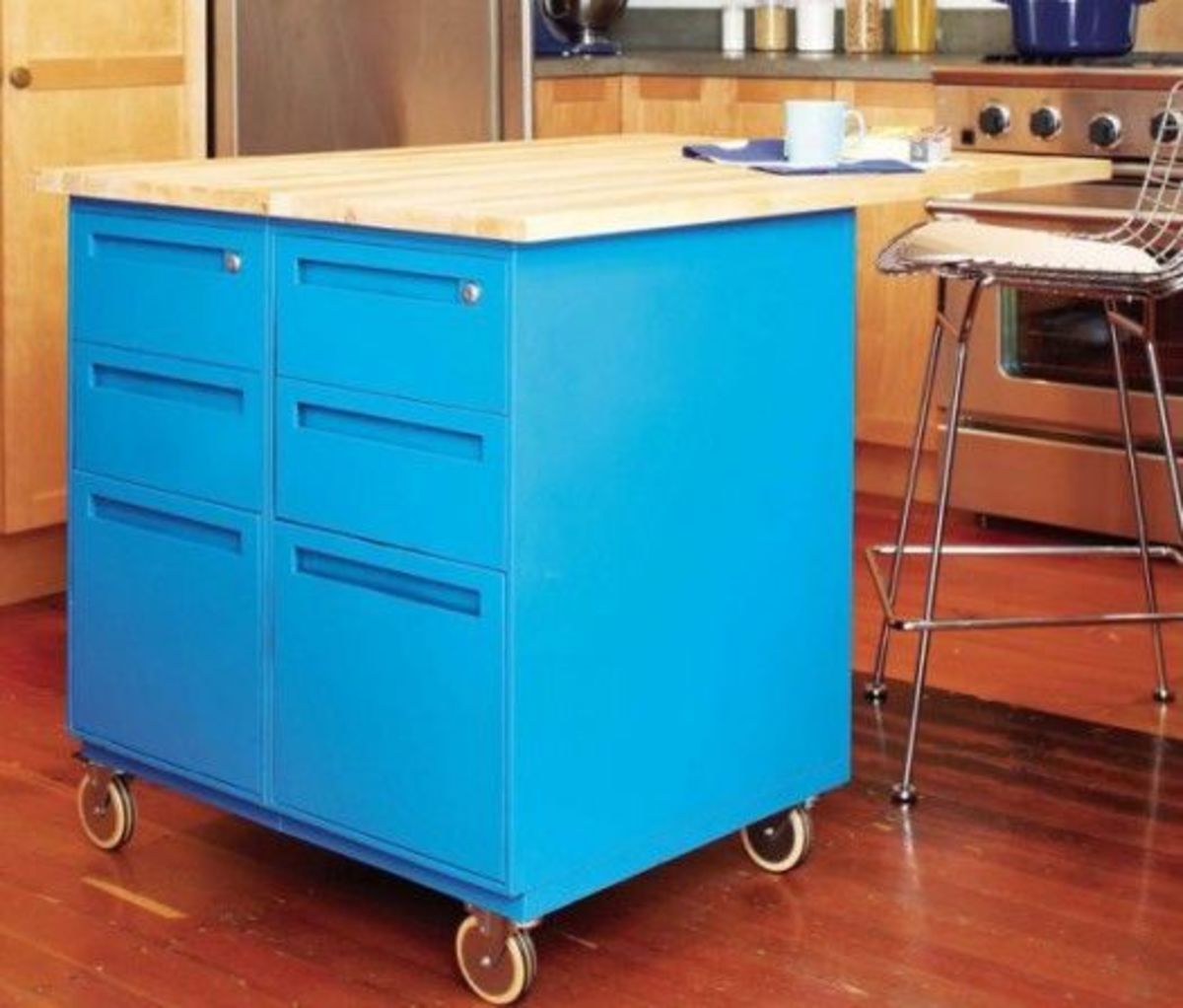 Paint can turn a drab old filing cabinet into a trendy kitchen island.