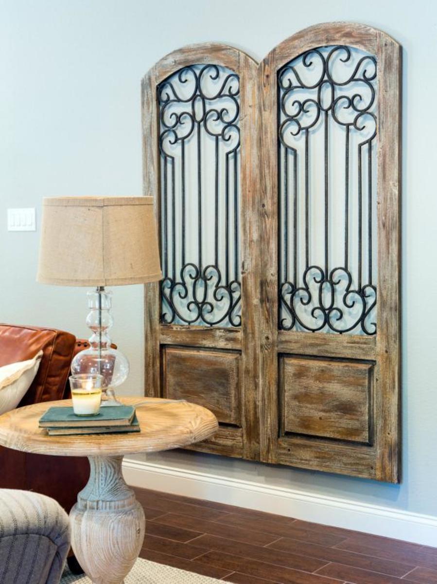 Antique doors fill a wall with texture and warmth.