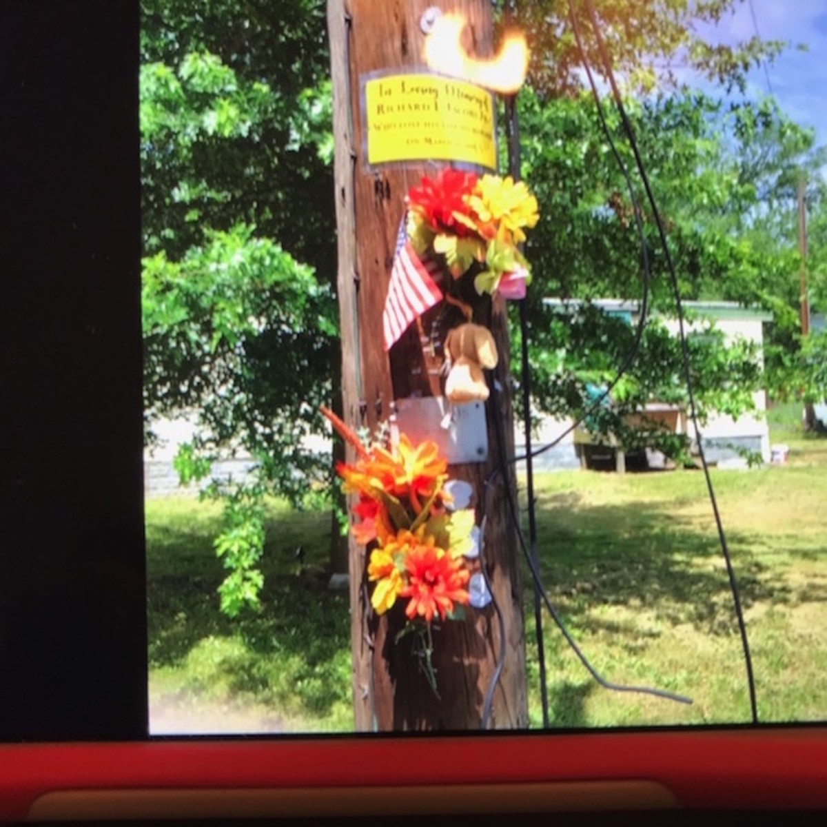 This is the memorial on a telephone pole near where Richard L. Jacobs Jr. drew his last breath.