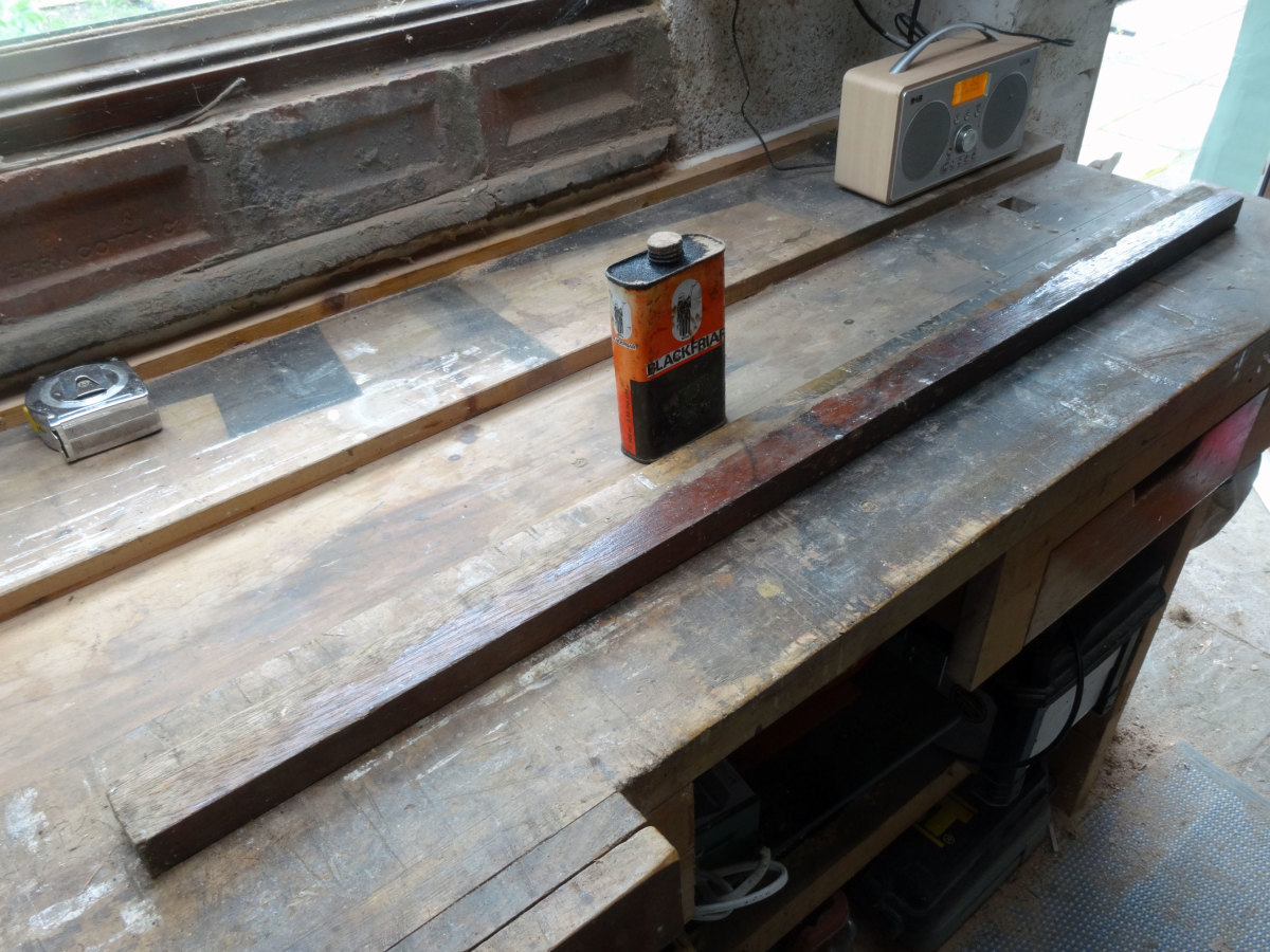 Teak wood salvaged from our old wooden French doors, to be used for fitting the blind to the brick wall.
