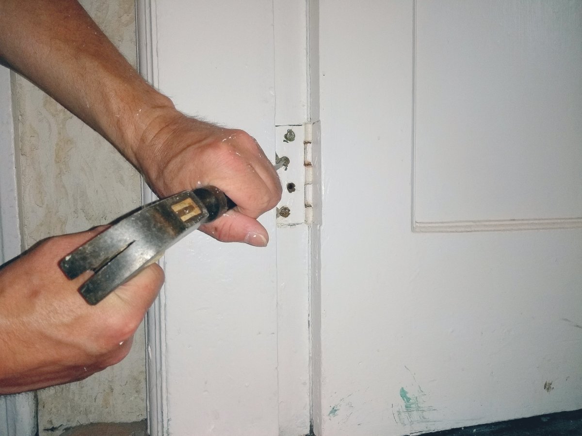 Clear the paint from the slots with a hammer and screwdriver.