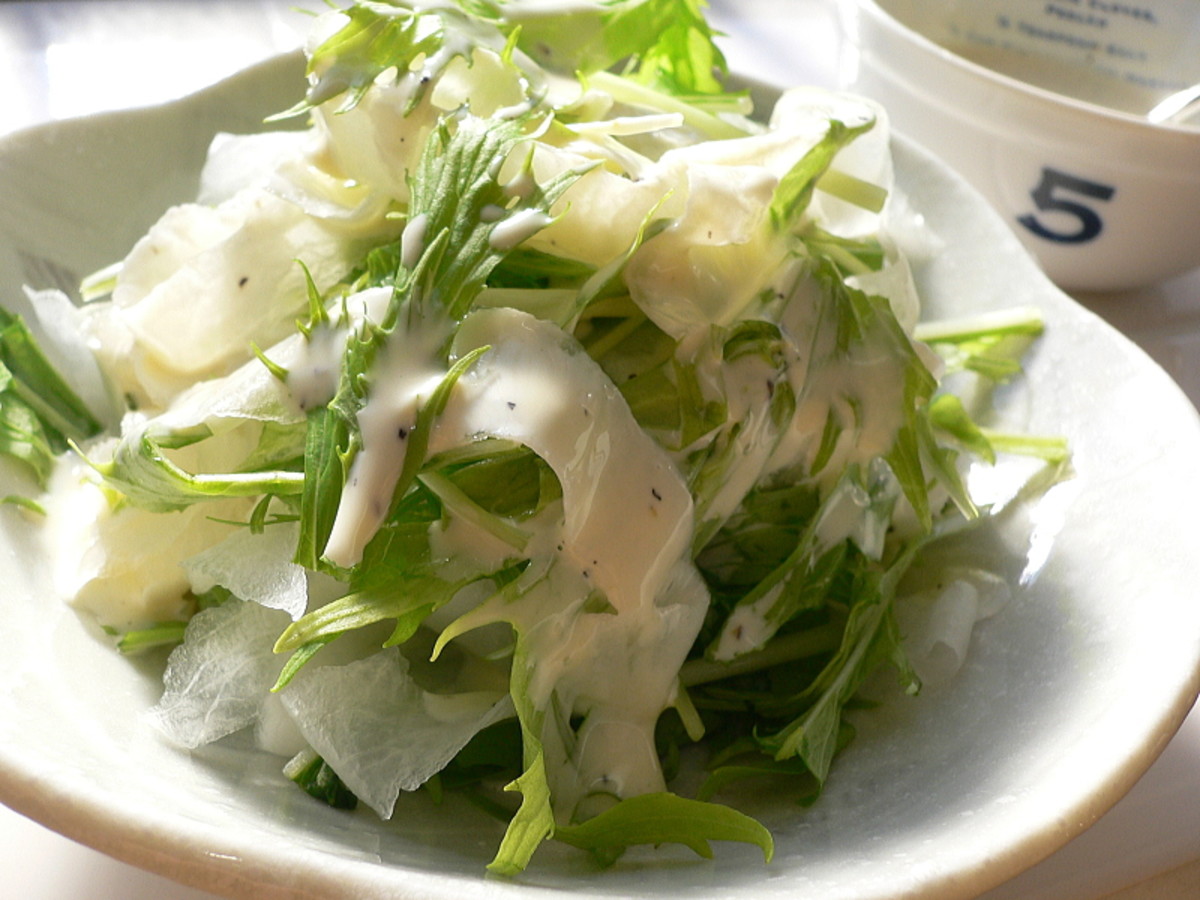 A salad made with mizuna and shaved daikon radishes.