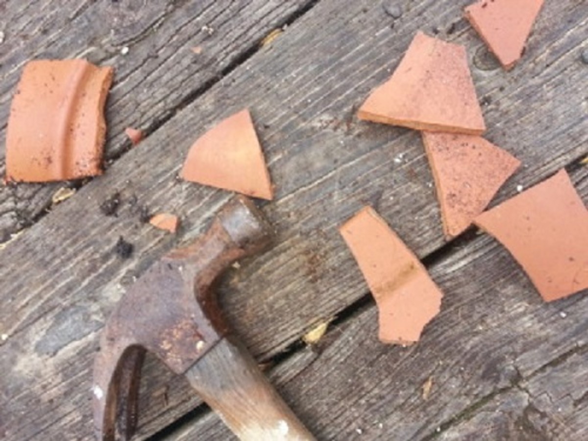 If a large piece broke off your pot, smash it up into smaller pieces. You can use these to decorate the fairy garden!