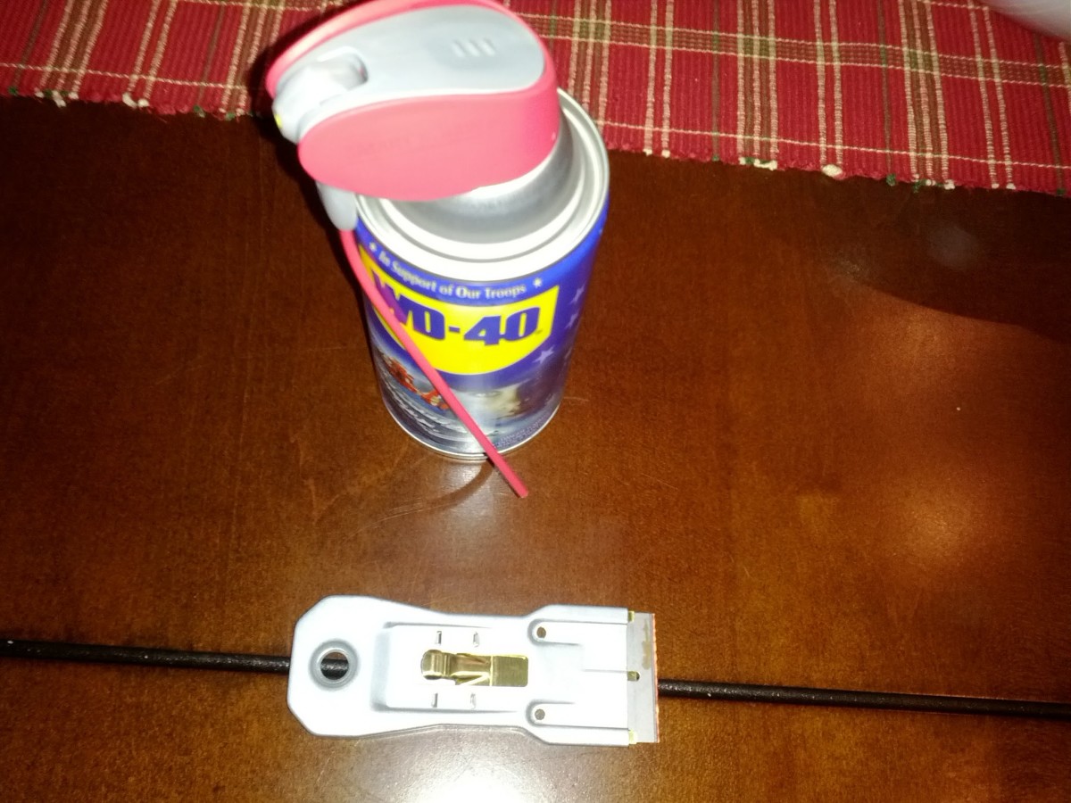 A razor blade with a handle and WD-40 will get plastic off of glass.